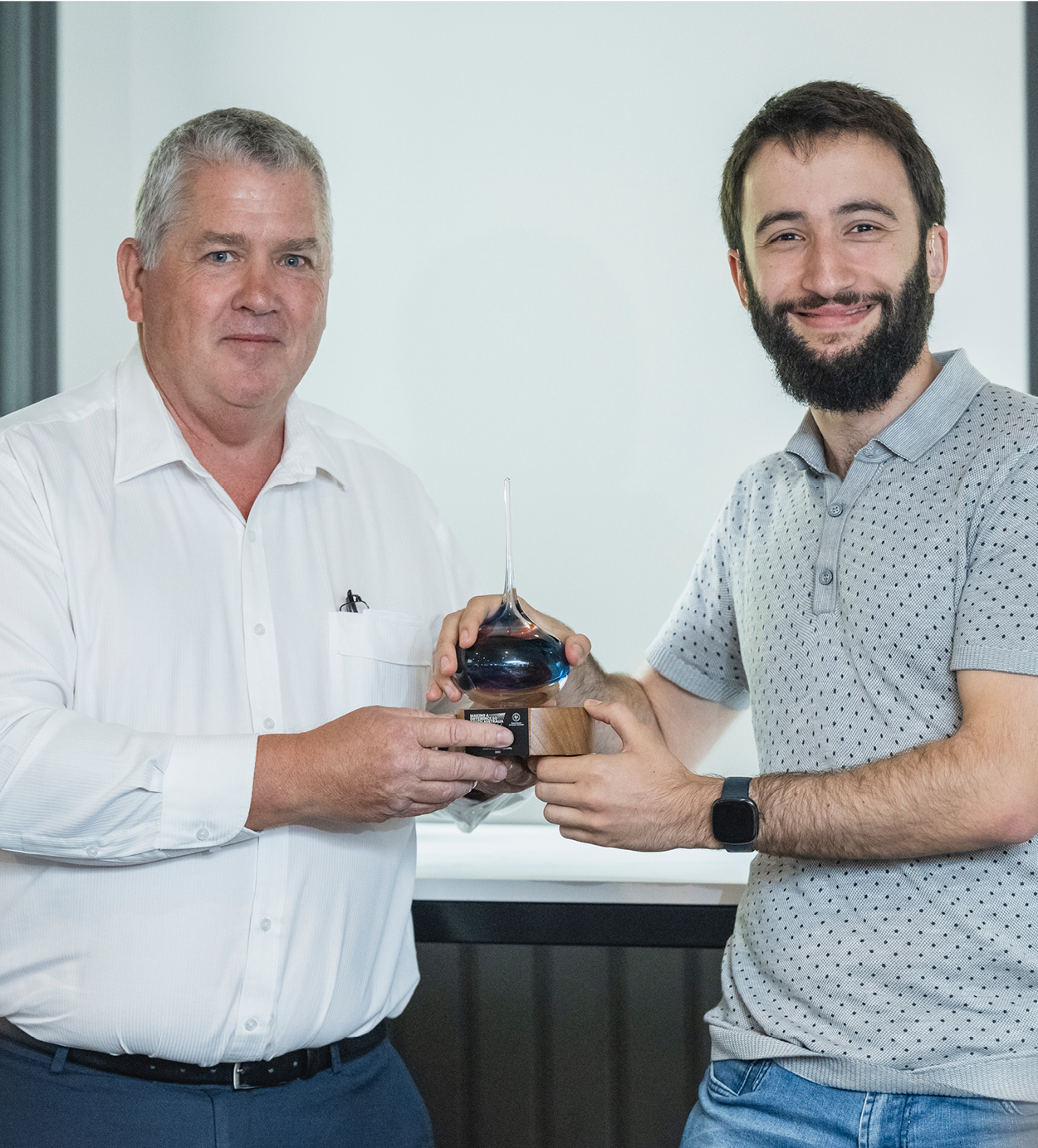 LSA Board member Kevin Cantley presents the LSA's Making a Difference Award to Harris Asimakopoulos. LSA Board member Kevin Cantley presents the LSA's Making a Difference Award to Harris Asimakopoulos