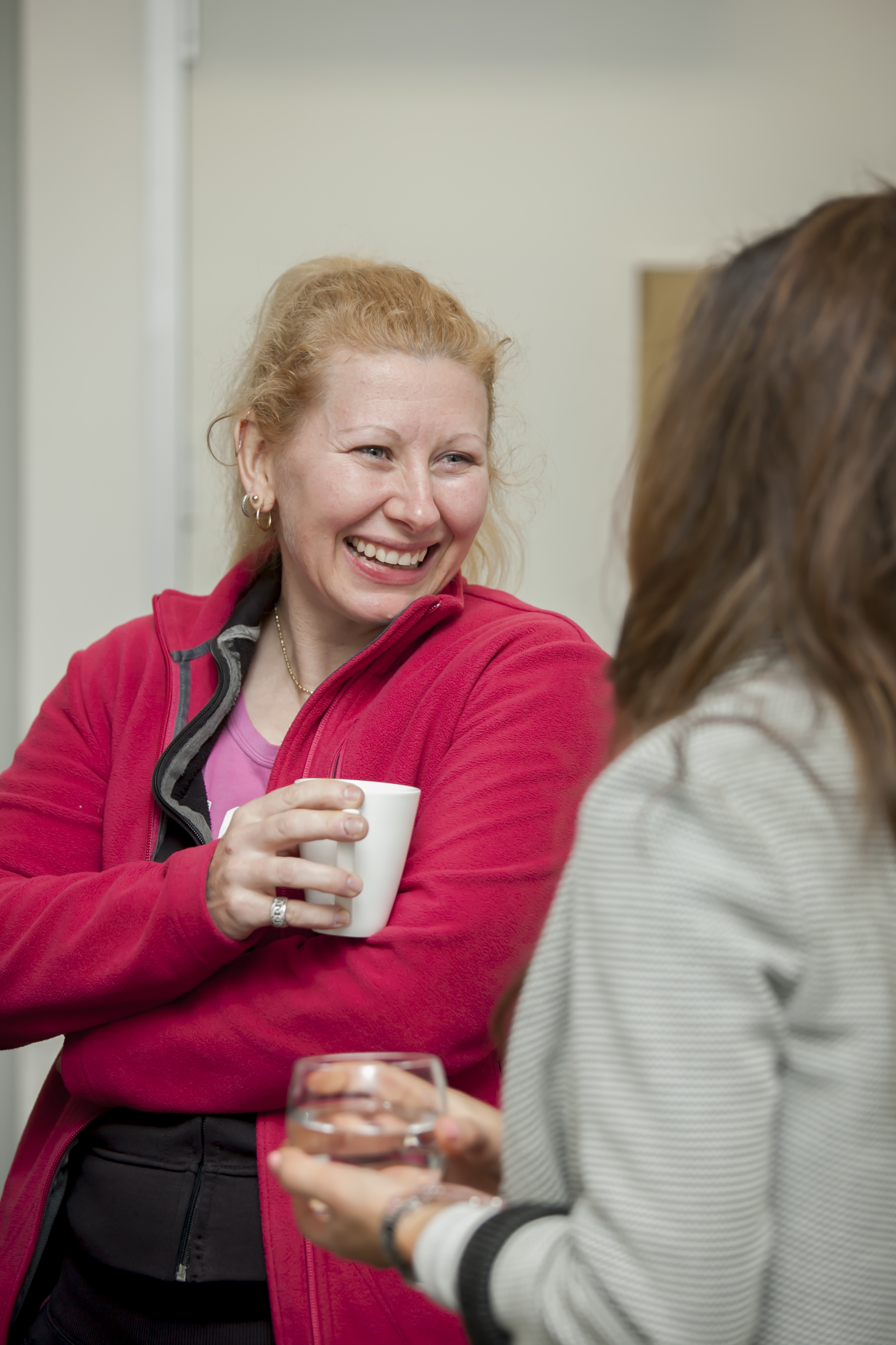 LSS Participant Tabitha Cox smiling and talking to another person.