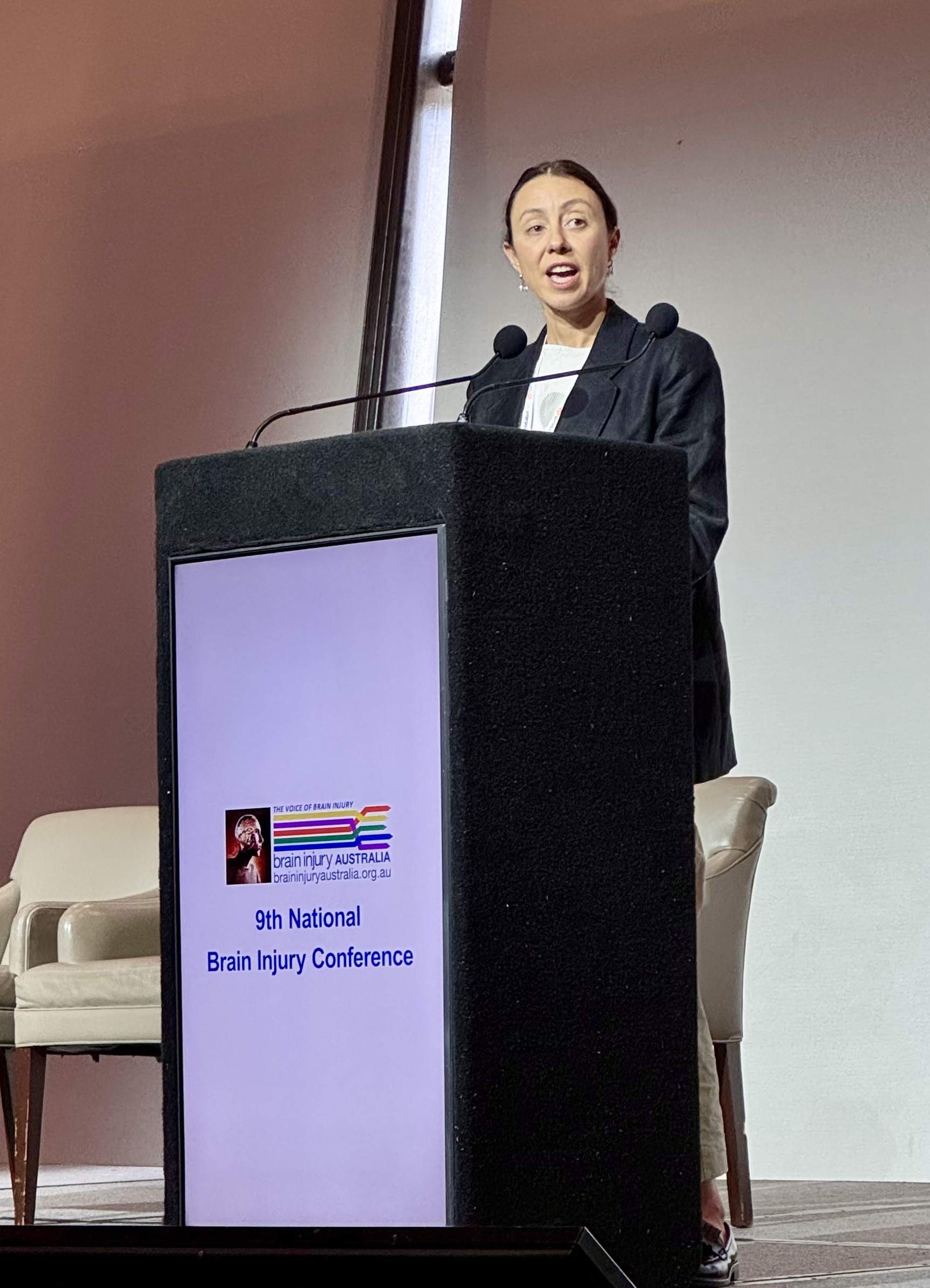 LSA Manager Caitlin Fulton speaking at a lectern.