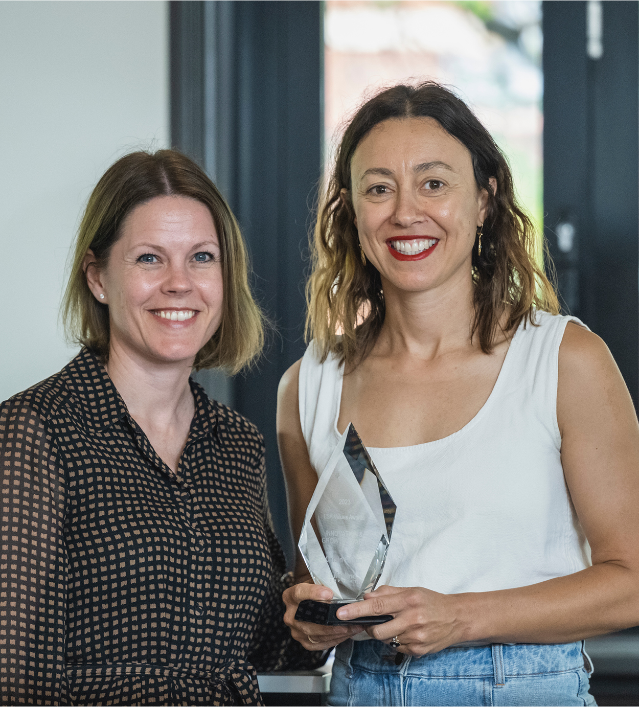 LSA Board member Sian Goodson presents the Innovation & Growth Award to Caitlin Fulton. LSA Board member Sian Goodson presents the Innovation & Growth Award to Caitlin Fulton